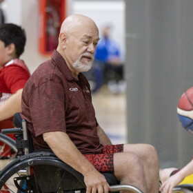 ParaSport Spokane assistant coach Z Zubrick and 11-year-old player Kaycen Dobbens.