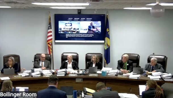 Montana Public Service Commissioner Brad Molnar sits on the far right at a hearing this week considering the merger between NorthWestern Energy and Black Hills