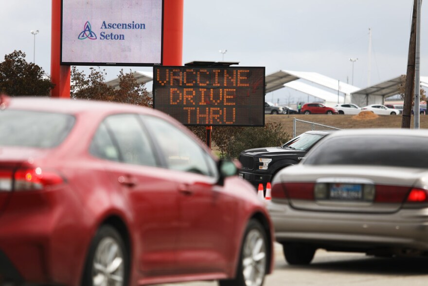 Drivers line up to get vaccinated at a drive-thru event at Circuit of the Americas last month. 