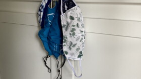Face masks hanging on a cabinet