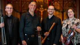 color photo of the musicians of The Early Interval holding their instruments