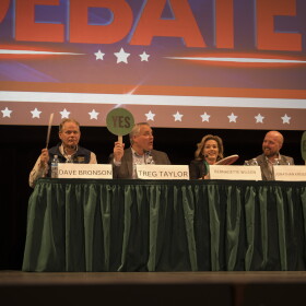 All four gubernatorial candidates were unsure how to answer one of the yes/no paddle questions during a fisheries debate in Kodiak on Sept. 9, 2026.