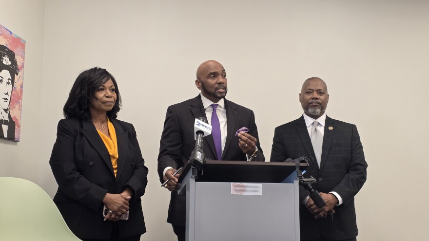 Damario Solomon-Simmons (center) addresses the media in Tulsa on Tuesday, March 10, 2026, flanked by Freedmen descendants Rhonda Grayson (left) and Jeff Kennedy (right).