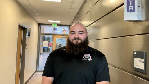 Zach Womer standing in a WPSU hallway.
