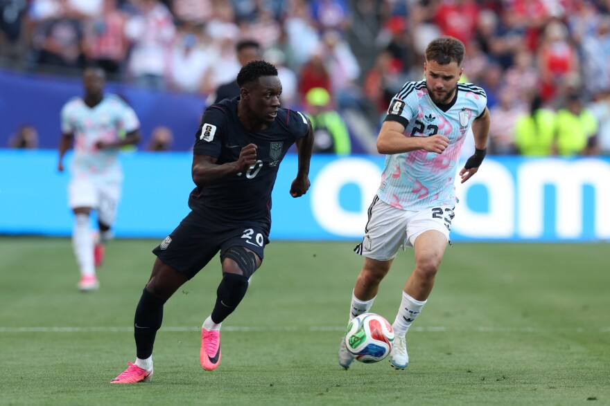 United States' Folarin Balogun (20) controls the ball against Belgium's Nicolas Raskin (23) during the World Cup round of 16 soccer match between the United States and Belgium in Seattle, Monday, July 6, 2026.