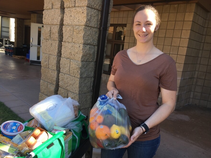 Kara Dethlefsen, an active-duty Marine, attends the monthly food pantry at the Camp Pendleton Marine Corps Base near San Diego. Her husband is also a Marine. She says the food assistance is helping them get ready for his transition back to civilian life. The couple has a 4-month-old daughter.