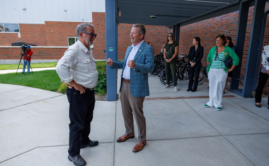 U.S. Sen. Gary Peters, left, and Michigan State University President Kevin Guskiewicz, right, visit the Facility for Rare Isotope Beams in East Lansing, Mich., on Aug. 28, 2026. The visit was the last stop on Peters' final motorcycle tour of Michigan as senator.