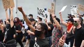Demonstrators march through the streets of Hollywood, California, on June 2, 2020, to protest the death of George Floyd at the hands of police. (Robyn Beck/AFP via Getty Images)