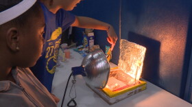Seventh graders Tamyah Conner (left) and Bella Rollins (right) of Center for Inquiry School 27 in Indianapolis made a solar oven for the school's climate fair in 2019.
