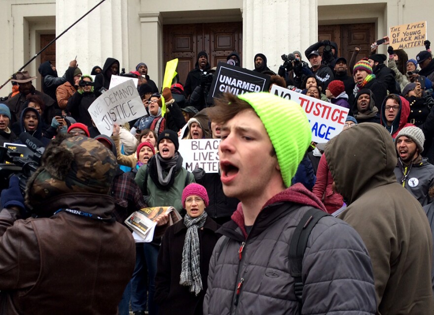 Protesters gather on the steps of the Old Courthouse in downtown St. Louis on Wednesday, November 26, 2014.