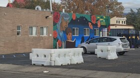 The encampment at Quirky used Books and More was how the owner said he would have a positive impact on his community, but it has been mired in controversy, a lawsuit and finally a shooting that could be it's downfall.