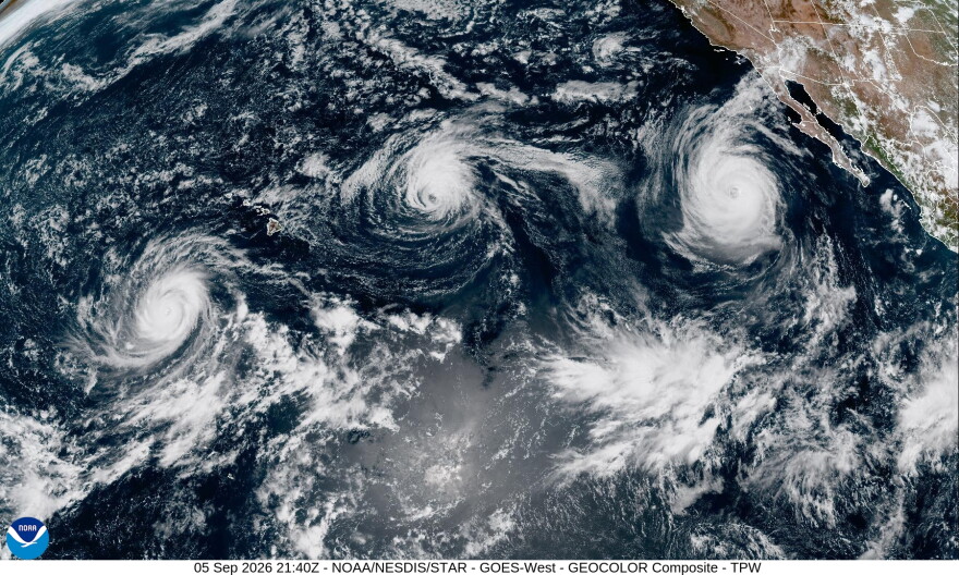 A satellite image shows from left to right, Hurricane Lowell, Hurricane Karina and Hurricane Marie in the Pacific on Saturday.