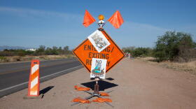 Anti-data center signs on traffic signage near the Pima County Fairgrounds southeast of Tucson. April 24, 2026.