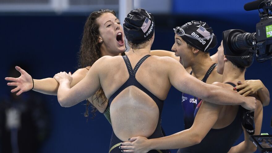 Allison Schmitt, Katie Ledecky, Madeline "Maya" DiRado and Leah Smith celebrate after they won the women's 4x200-meter freestyle relay for the U.S. Wednesday night at the Rio Olympics.