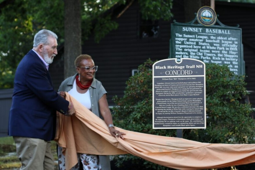 Concord Mayor Byron Champlin (L) and Black Heritage Trail of New Hampshire Executive Director JerriAnne Boggis unveil a marker honoring William Penn Thompson, a black baseball player, in Concord on Aug. 12, 2026.