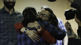 Mary Peltola hugs Dawn Nelson, a daughter of the late Congressman Don Young, at 49th State Brewing Company on election night. Peltola's campaign hosted a watch party at the downtown Anchorage restaurant on Tuesday, Aug. 16, 2022. (Mizelle Mayo/Alaska Public Media)