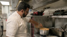 Pictured: St. Thomas Social partner and executive chef, Sunil Sharma, prepares food to distribute to SNAP beneficiaries.