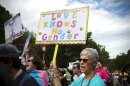 Protest holds sign reading "Love Knows No Gender" at Gay Pride Transgender March in Atlanta 