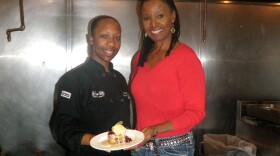 Executive Chef Karida Celestine and restaurateur B. Smith present their Bourbon Street Bread Pudding at Smith's eponymous restaurant in Washington, D.C. 