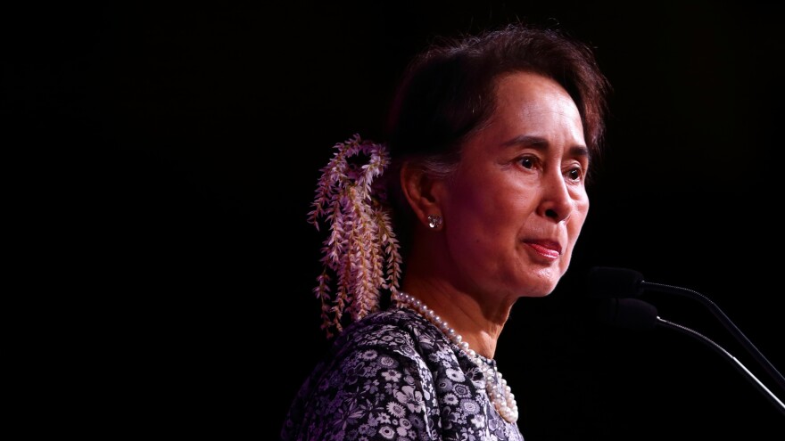 Aung San Suu Kyi speaks during the 33rd Association of Southeast Asian Nations summit on Monday in Singapore. Amnesty International says it has withdrawn the Ambassador of Conscience Award given to Suu Kyi "in light of the Myanmar leader's shameful betrayal of the values she once stood for."