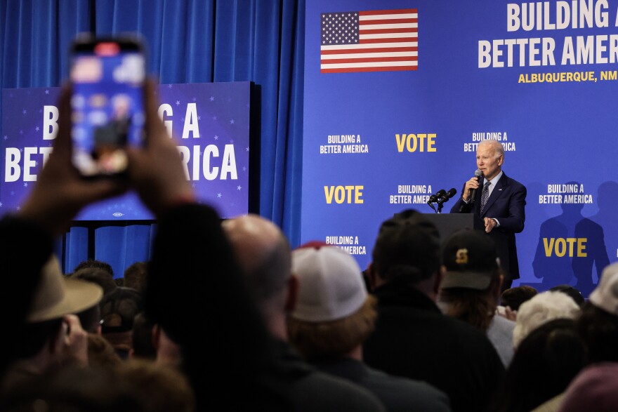 A supporter record President Biden's speech on his phone during Thursday's rally.