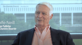  Rolfe Neill in front of the Charlotte Observer building