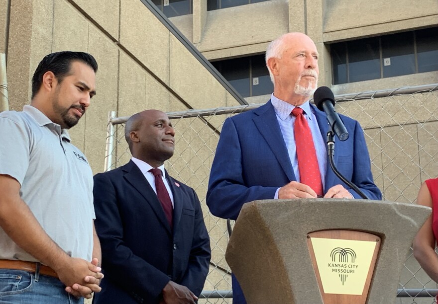 Manny Abarca, left, Mayor Quinton Lucas, middle, and councilman Kevin O'Neil, right, at a press confrence discussing the death of Jose Rodolfo Garcia on July 8 at the former At&T building.