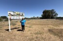 Allysunn Walker stands on currently empty land that belongs to the West Side Church of God in Fresno, Calif. The site will eventually house seniors on fixed incomes.
