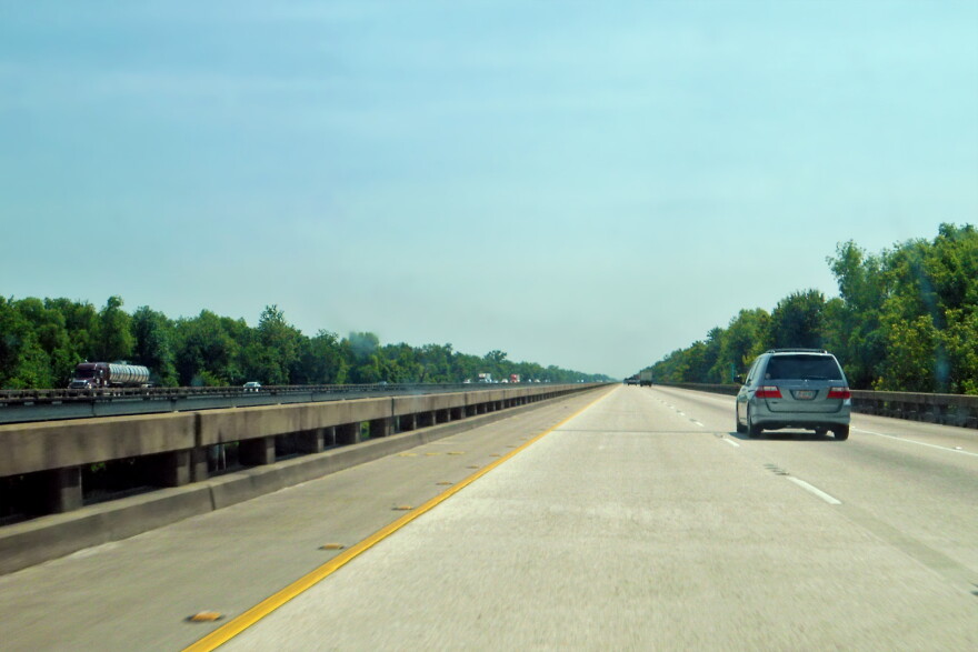 car on highway bridge