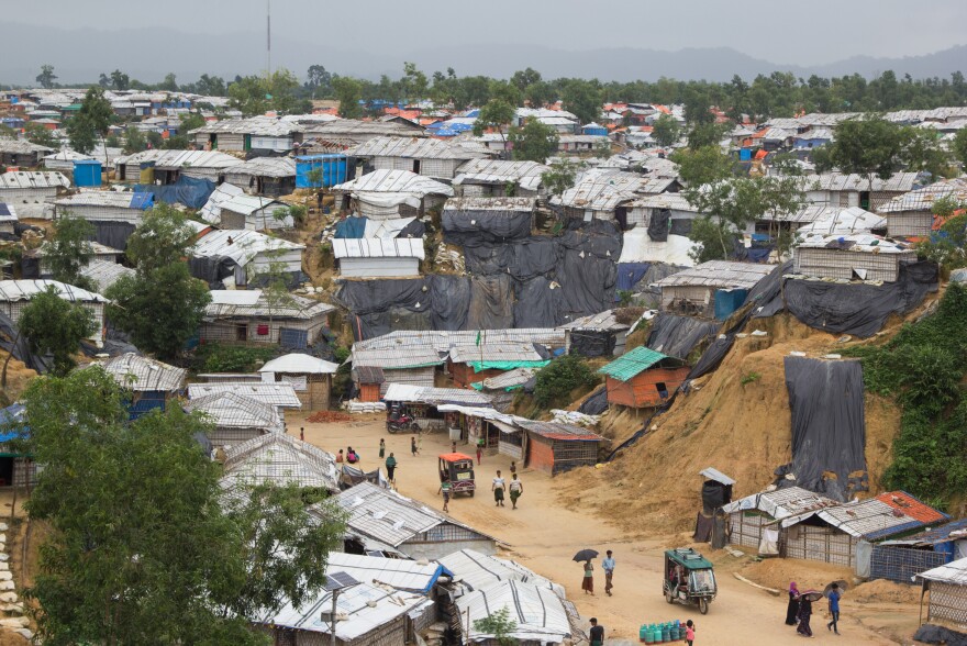 The steep, sandy hills in Bangladesh's Rohingya refugee camps are covered in black plastic to keep them from eroding away in the intense monsoon rains.