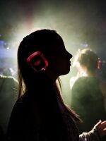 A woman wearing headphones dances in a disco during the Clockenflap Music Festival in Hong Kong, China last year.