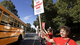 Teacher Jennifer Hall pickets with about 50 colleagues outside West Seattle High School last week.