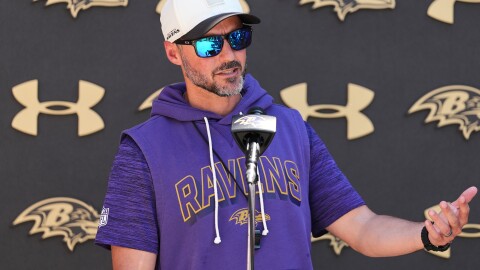 Baltimore Ravens head coach Jesse Minter speaks during a press conference after the NFL football team's practice, Tuesday, May 19, 2026, at the Under Armour Performance Center in Owings Mills, Md. (AP Photo/Stephanie Scarbrough)