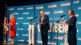 Republican incumbent Jen Kiggans, left, meets on the stage Democratic challenger Missy Cotter Smasal at a debate Friday, Oct. 11, 2024 in Virginia Beach. Chris Saxman, center, moderated.