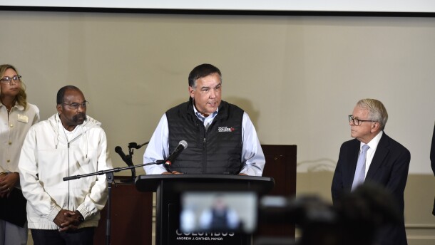 Columbus Mayor Andrew Ginther addresses reporters alongside Ohio Governor Mike DeWine and State Senator Hearcel Craig at Columbus Public Health a day after severe storms battered the state on August 12, 2026.