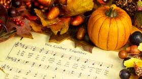 Music for the hymn "We Gather Together" with Thanksgiving decorations