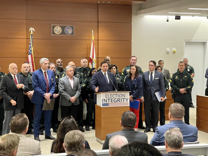 Governor Ron DeSantis speaks to supporters and press inside a Broward Courtroom. DeSantis announced the arrests of 20 people for illegally voting while surrounded by Election Crimes and Security Office Director Peter Antonacci, Attorney General Ashley Moody, Secretary of State Cord Byrd, and Mark Glass, acting commissioner of the Florida Department of Law Enforcement.