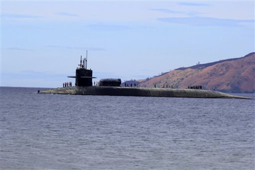 The USS Michigan, a guided missile submarine that calls Naval Base Kitsap home, prepares to dock at the Subic Bay Freeport Zone in the Philippines on March 25, 2014.