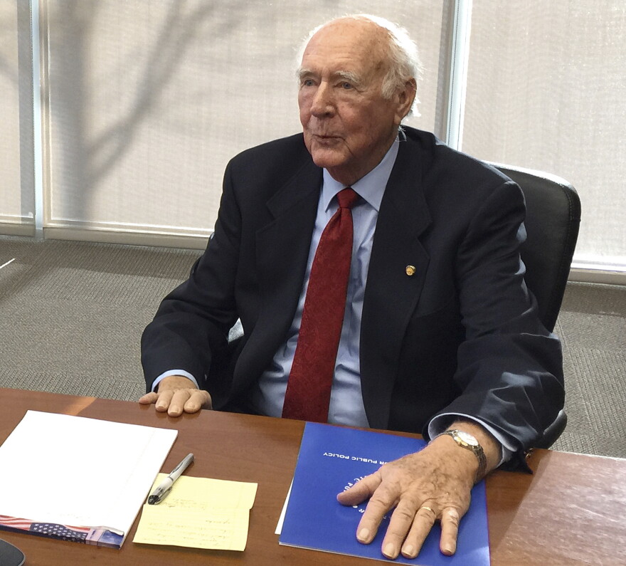 FILE - In this Jan. 15, 2015, file photo, former Idaho Gov. Cecil Andrus talks to reporters in Boise, Idaho.