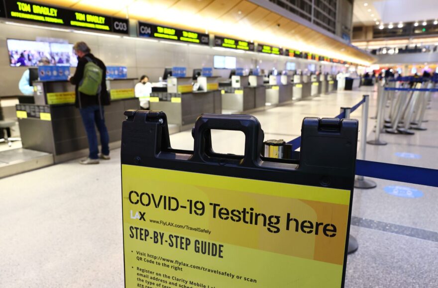 The Biden administration is planning to announce tighter restrictions for travelers flying into the United States, including requiring a negative test for COVID-19 one day ahead of travel, in response to the new Omicron variant.