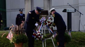 A wreath is placed in front of a steal beam from the World Trade Center, which was targeted in the attack, during Bloomington's Ivy Tech Community College's annual 9/11 ceremony on Sept. 11, 2025.