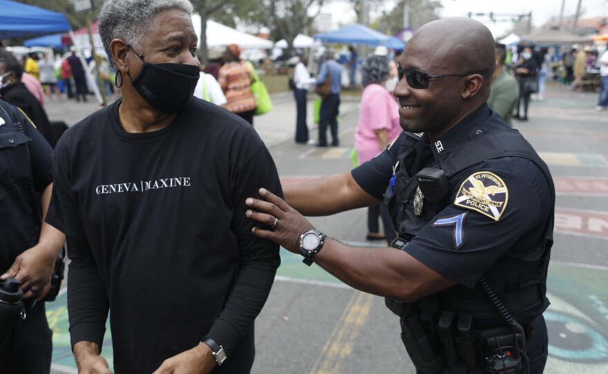 Retired St. Petersburg Police Department Chief Luke Williams is greeted by his friends and former colleagues during the 2022 Publix Tampa Bay Collard Festival in St. Petersburg, Florida, on Saturday, February 19, 2022. Photo by Octavio Jones for WUSF