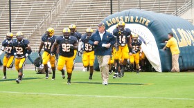 The A&M-Commerce Lions with head coach Guy Morriss.