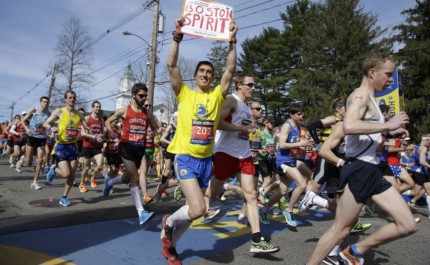 Runners in the first wave of 9,000 cross the start line on Monday.