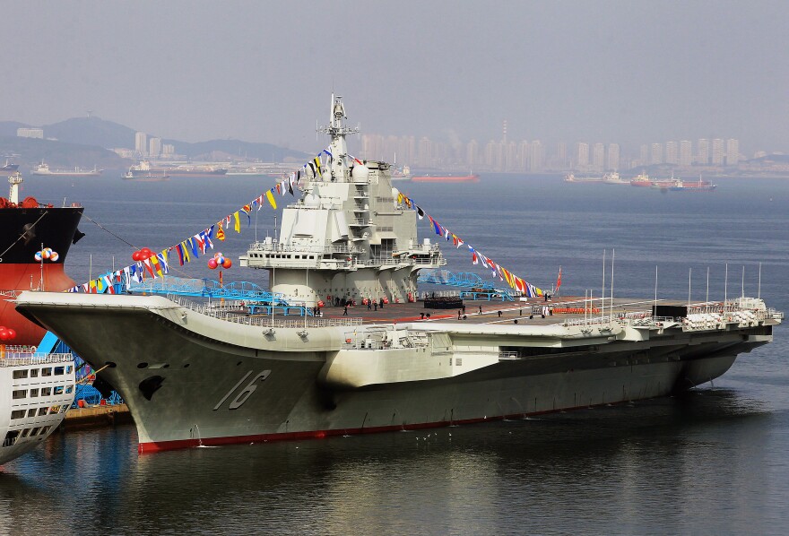 China's first aircraft carrier, shown here in the northeastern port of Dalian, was officially put into service on Sept. 25. The carrier is seen as a symbol of China's growing military might.