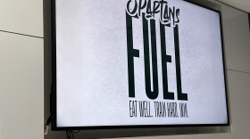 A “Spartans Fuel” sign at the fueling station at Munn Ice Arena. It reminds athletes to “Eat well. Train hard. Win.”