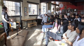 Delilah Morss sharing their story at the Teens Grow Greens mini StorySlam in February of 2023. Photo taken by Kelly Anderson.