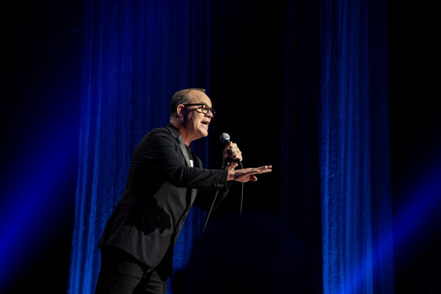 Tom Papa performs during one of his Netflix stand-up specials.