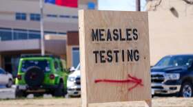 File: A sign is seen outside of Seminole Hospital District offering measles testing, Feb. 21, 2025, in Seminole, Texas. (AP Photo/Julio Cortez), File)