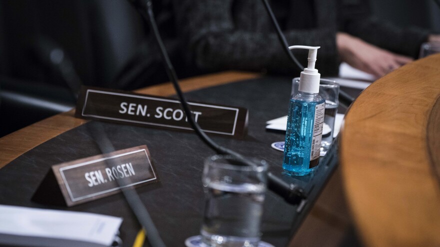 A bottle of hand sanitizer is seen during a Senate Homeland Security Committee hearing on Capitol Hill Thursday. Lawmakers are preparing to what to do if coronavirus hits the Capitol.